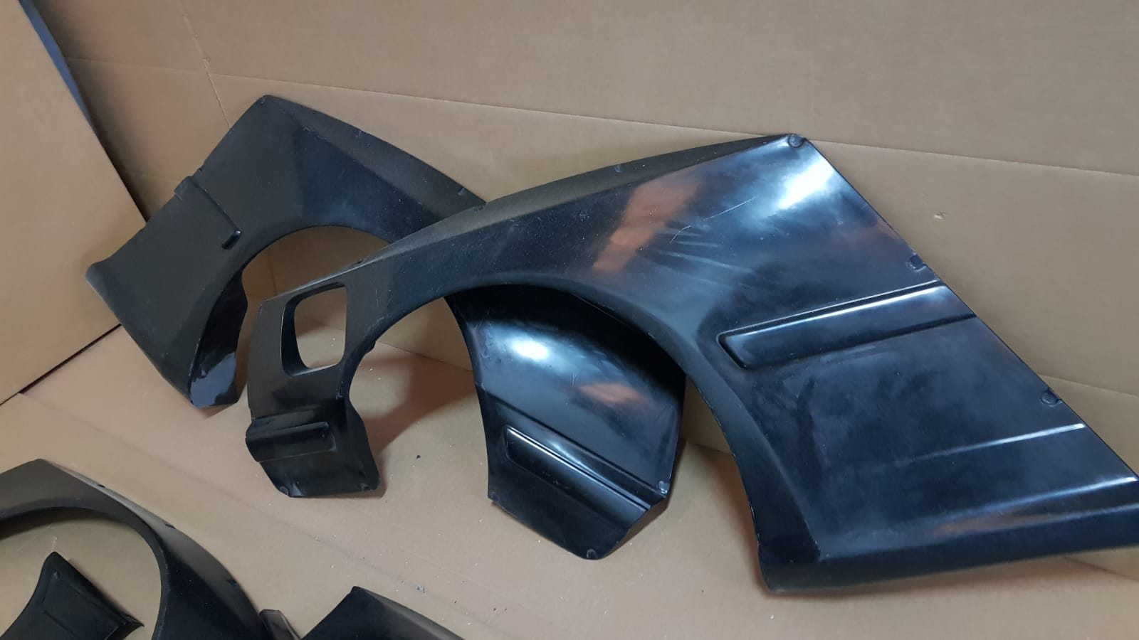 Widebody front and rear fender extensions from Rocket Bunny kit for BMW E36 Coupe.