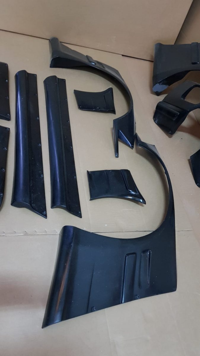 BMW E36 Coupe Rocket Bunny style side skirts and overfender components.