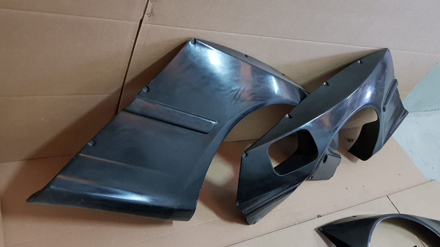 Rocket Bunny style rear widebody fenders for BMW E36 Coupe body kit.