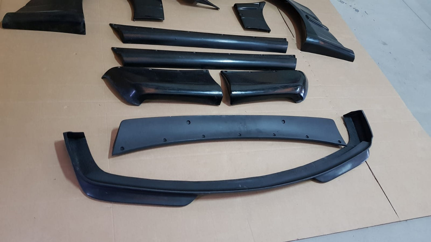 Rocket Bunny style front lip and widebody elements for BMW E36 Coupe.