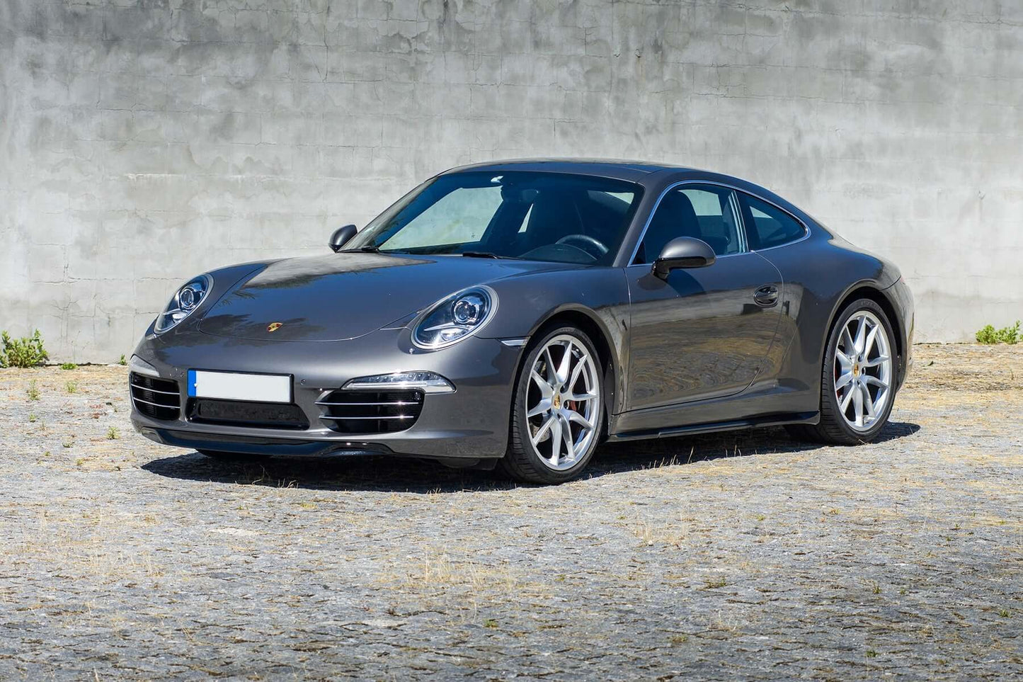 Side skirts blades Porsche 911 991 PH1 on a grey Porsche, visible along the bottom edge of the side panel, delivering a refined performance look.