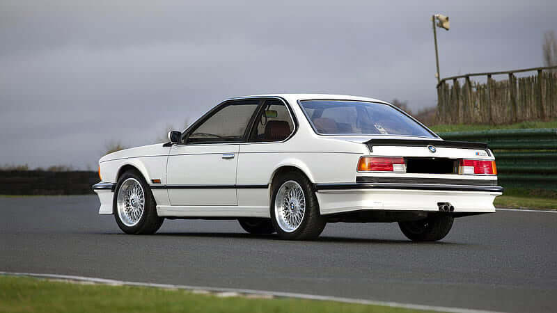 TRUNK SPOILER BMW E24 ALPINA fitted on a white BMW E24, shown from the rear three-quarter view