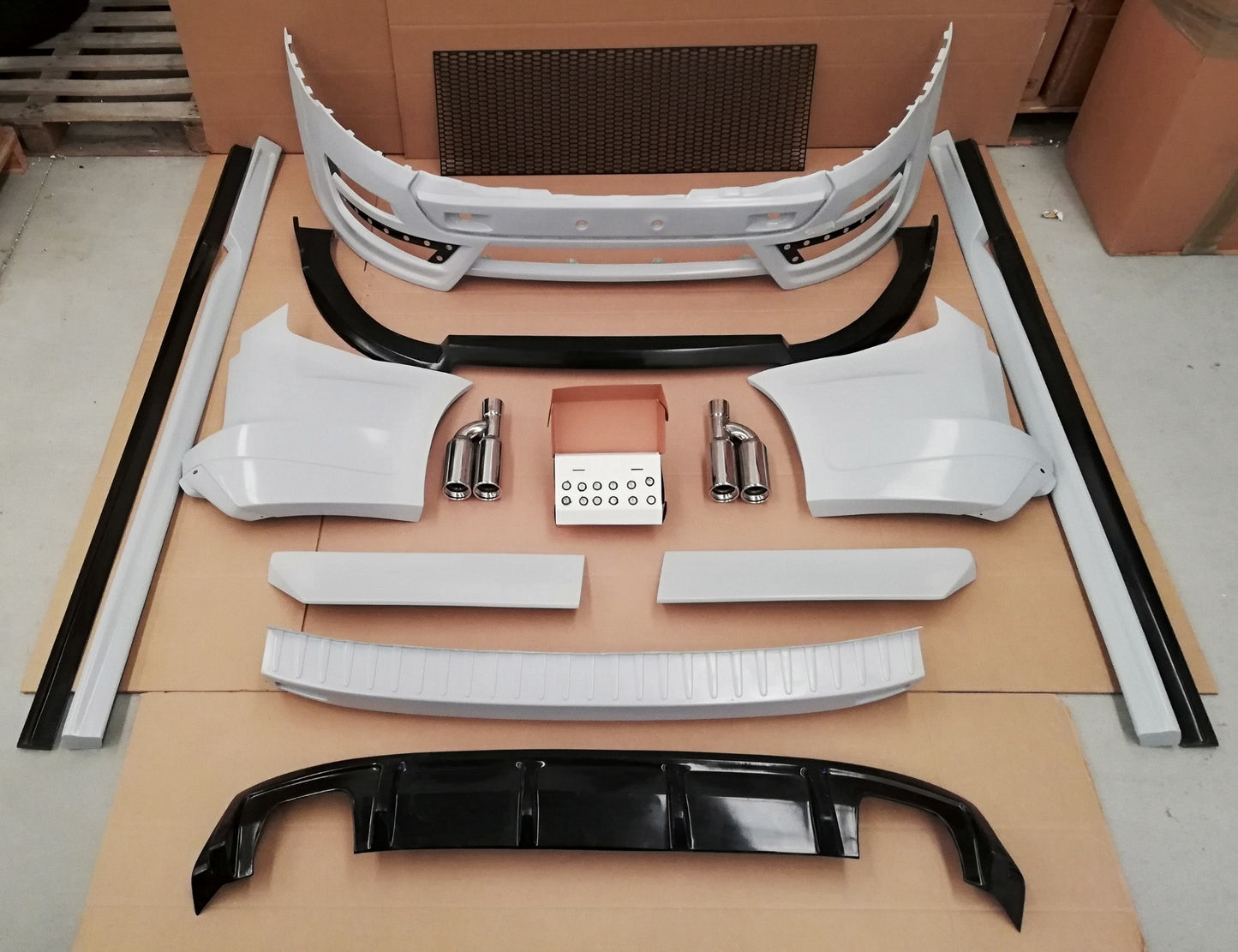 Body Kit Ford Transite Custom 12-18: Front Bumper, Front Lip, Rear Diffuser, Rear Top Bumper Cover, Set of Rear Corner Panel (2 Pieces), Top Rear Spoiler (2 Pieces), Set of Side Skirts (2 Pieces), Set of Side Skirts Extensions (2 Pieces), Set of Rear Exha