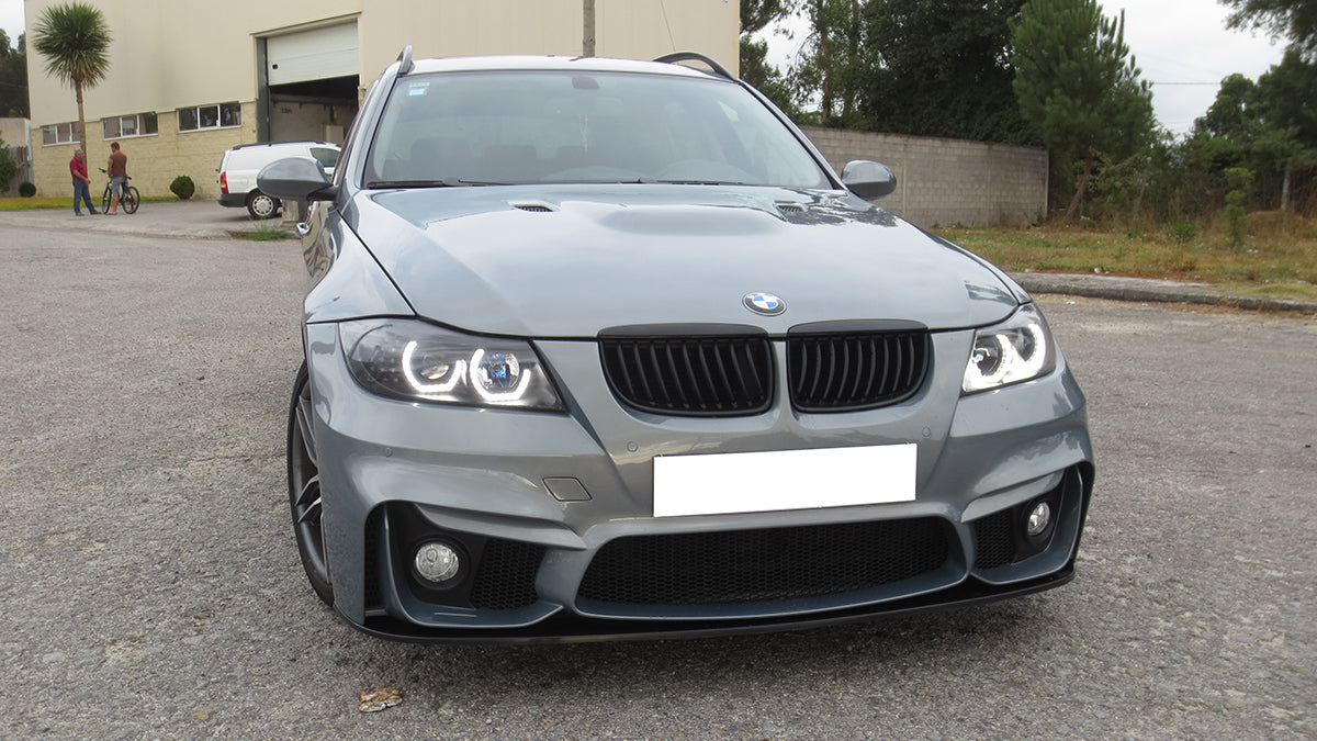 Front close-up of BMW 3 Series E91 pre-LCI fitted with M4 style front bumper and fog lights.