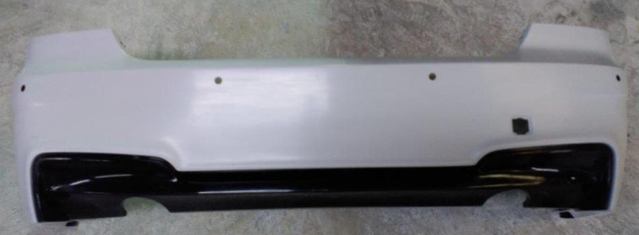 Rear bumper for BMW 3 Series Coupe E92/E93 in 1M Look design, painted in white with black lower section for a sporty and aggressive style.