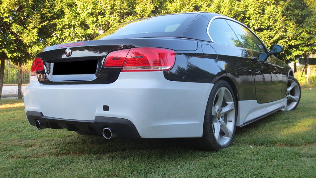 BMW 3 Series E92/E93 coupe with FR Style rear bumper, shown in two-tone finish, featuring dual exhaust outlets and black diffuser.
