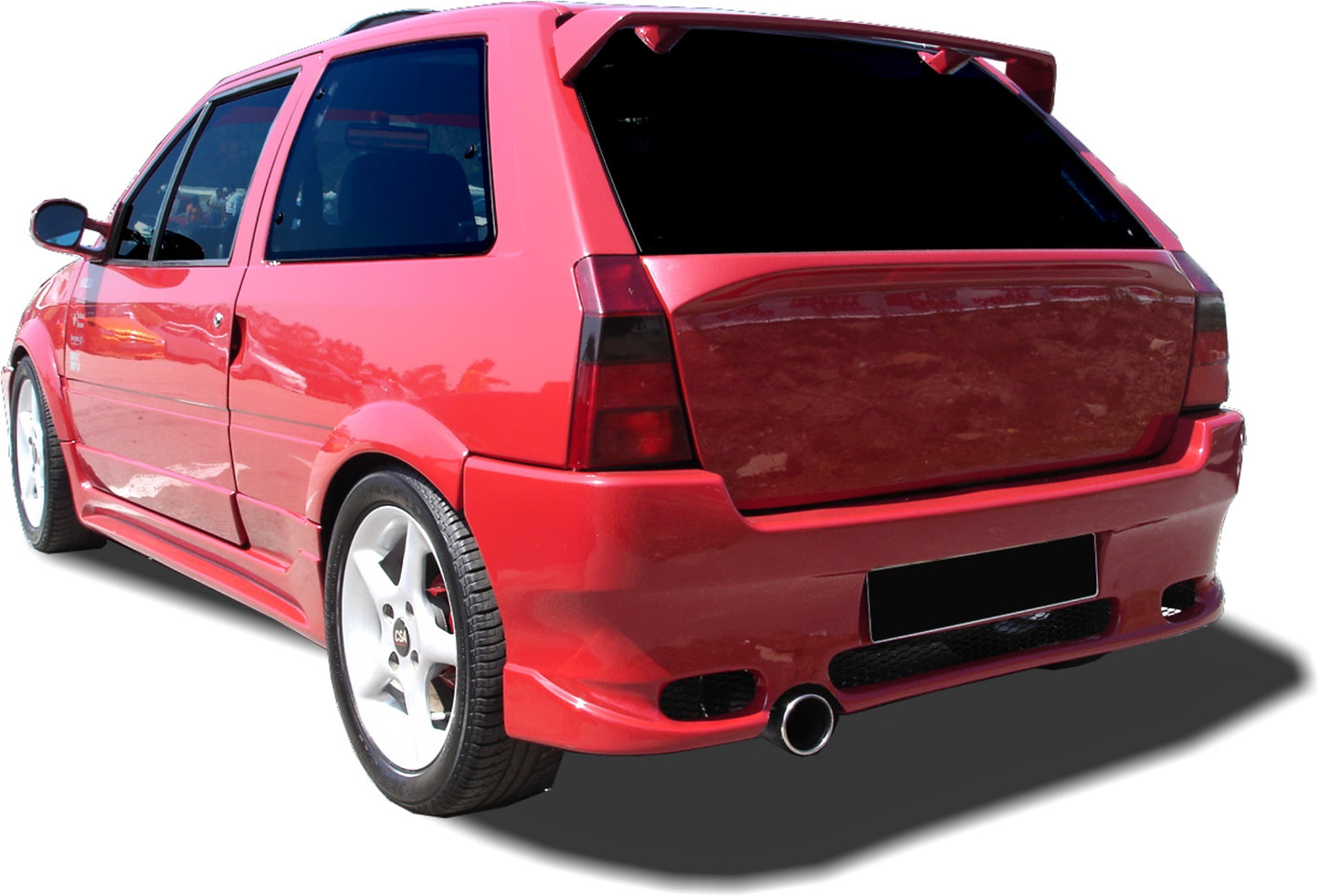 Red Citroën AX with Space rear bumper, featuring a wide and sporty design with integrated exhaust outlet and aerodynamic styling.