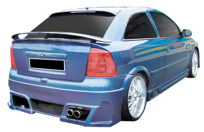 Blue Opel Astra G with Pyton rear bumper installed, viewed from the rear-left angle, showing the dual exhaust outlets, aerodynamic design, and sporty spoiler.