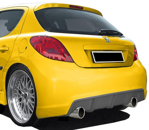 Yellow Peugeot 207 with Sport rear bumper installed, viewed from the rear-left angle, showing the dual exhaust outlets, diffuser design, and silver alloy wheels.