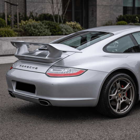 TRUNK SPOILER PORSCHE 911 997 fitted on a silver Porsche 911, shown from the rear three-quarter view