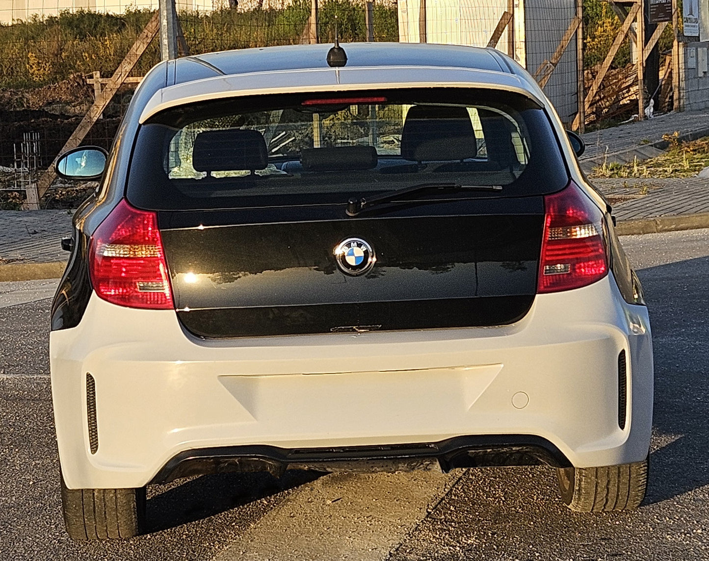 Back View of Rear Bumper BMW 1 Series E81/E87 M2 Look on vehicle. Made from 1st grade FRP (reinforced fiberglass)