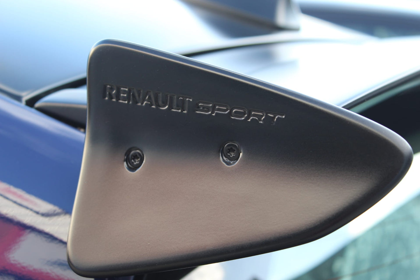 Close-up of Roof Spoiler for Renault Clio III Sport on vehicle. Made from 1st grade FRP (reinforced fiberglass)