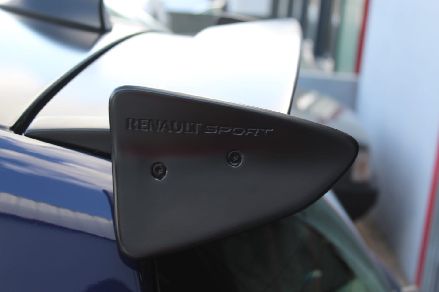 Close-up of Roof Spoiler for Renault Clio III Sport on vehicle. Made from 1st grade FRP (reinforced fiberglass)