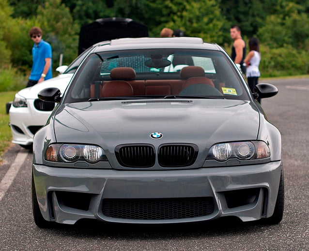 Front View of Front Bumper for BMW 3 Seires E46 1M Look on vehicle. Made from 1st grade FRP (reinforced fiberglass)