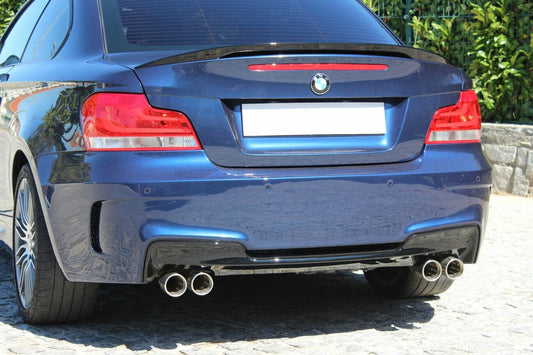Rear bumper BMW 1 Series E82/E88 1M look with quad exhaust outlets and sporty design.