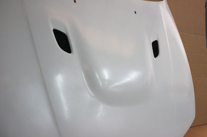 Angled view of bonnet BMW 1 Series E81/E82/E87/E88 M1, focusing on vent shape and raised centre section.