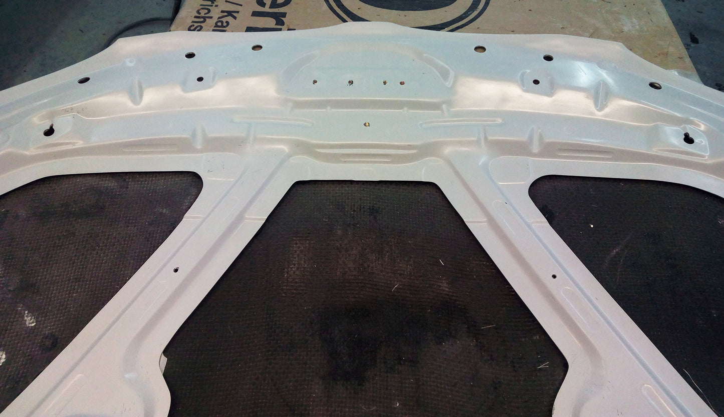 Underside of bonnet BMW 1 Series E81/E82/E87/E88 M1, highlighting the full structural frame and pre-drilled mounting holes.