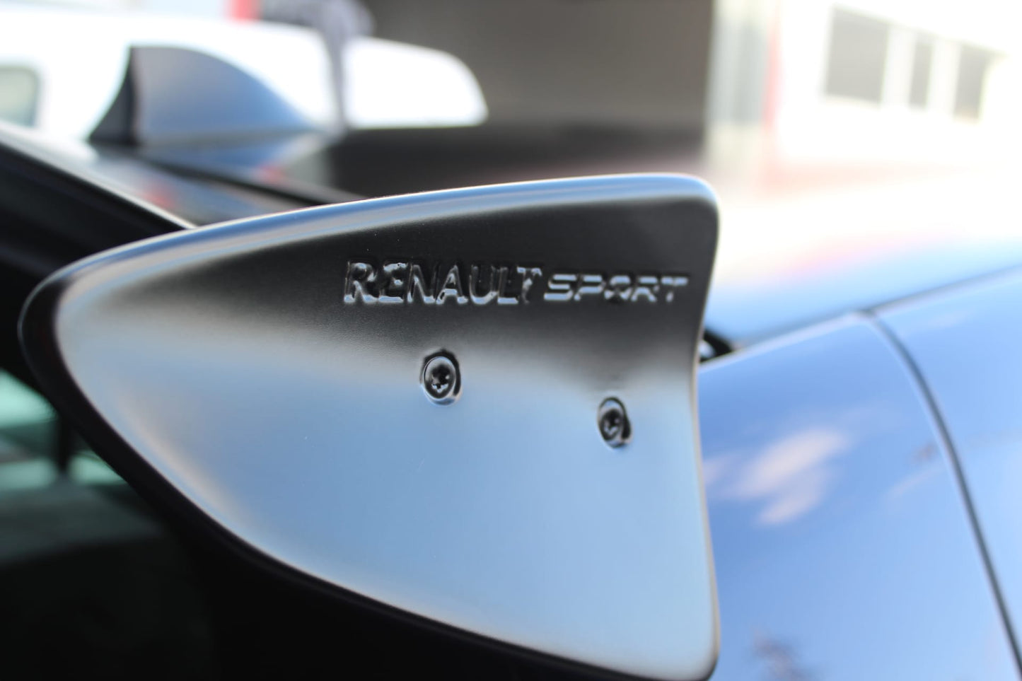 Close-up of Roof Spoiler for Renault Clio III Sport on vehicle. Made from 1st grade FRP (reinforced fiberglass)