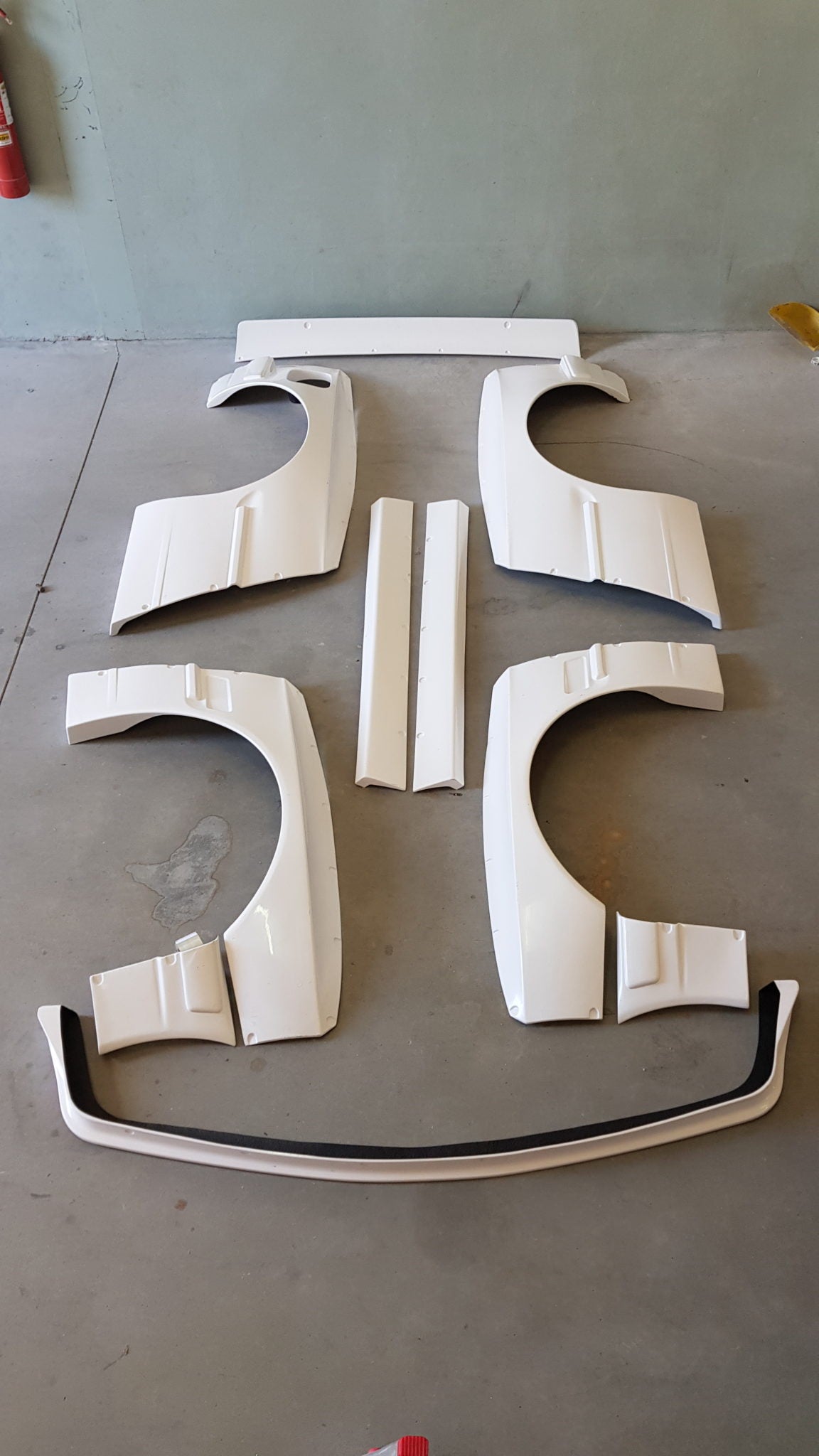 Body Kit BMW E30 Coupe "Rocket Bunny". Parts supplied: Front Lip, Front Fenders, Front Bumper Corners, Side Skirts, Rear Bumper Corners, Rear Panels, Trunk Spoiler
