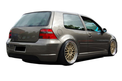 Back view of a Volkswagen Golf IV in brown with aftermarket rear bumper R-Line style.
