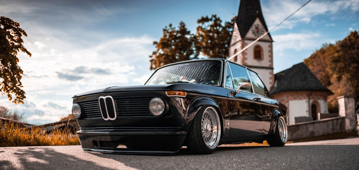 Front View of Front Lip for BMW 2002 Turbo on vehicle. Made from 1st grade FRP (reinforced fiberglass)