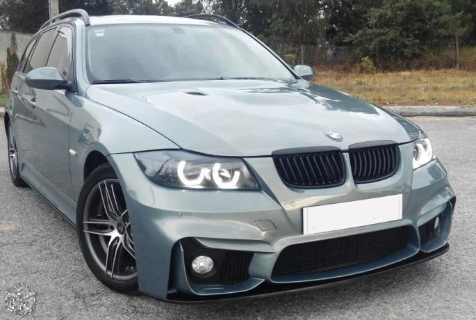BMW E91 Touring with M4 style front bumper and black lip blade, modified headlights and wheels