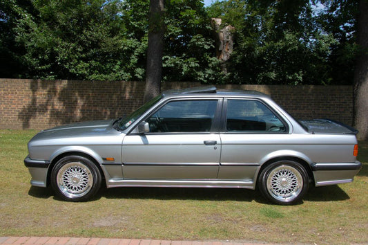 Side View of Side Skirts for BMW E30 2 Doors M Look on vehicle. Made from 1st grade FRP (reinforced fiberglass)