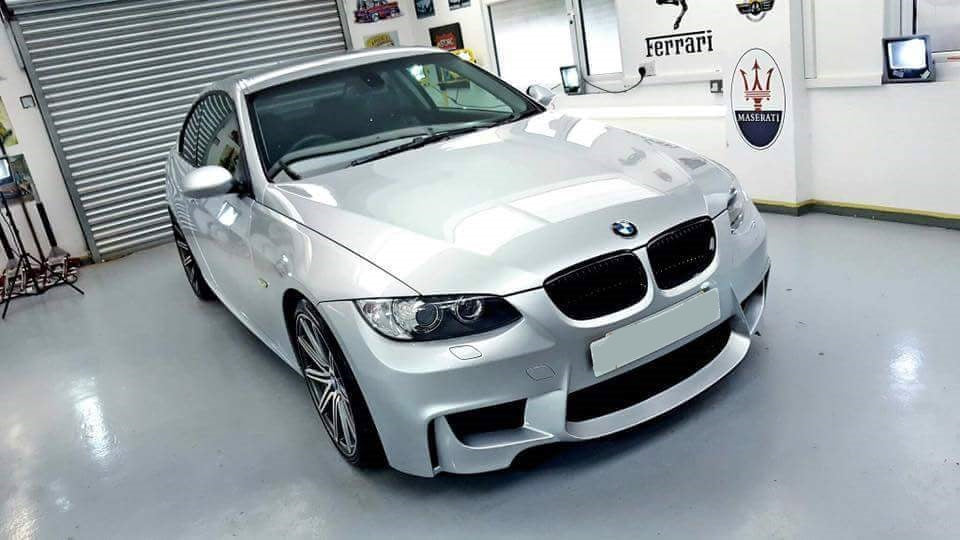 Front View of Front Bumper for BMW 3 Series M3 Coupe E92/E93 PRE-LCI 1M Look on vehicle. Made from 1st grade FRP (reinforced fiberglass)  