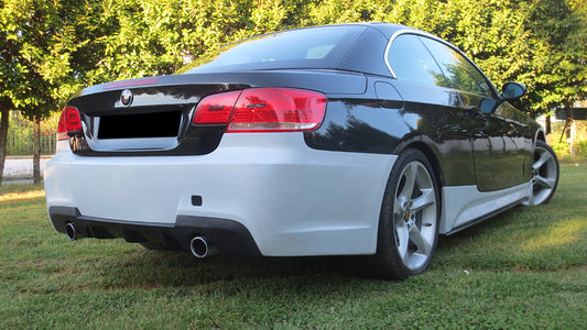 BMW 3 Series E92/E93 coupe with FR Style rear bumper, shown in two-tone finish, featuring dual exhaust outlets and black diffuser.