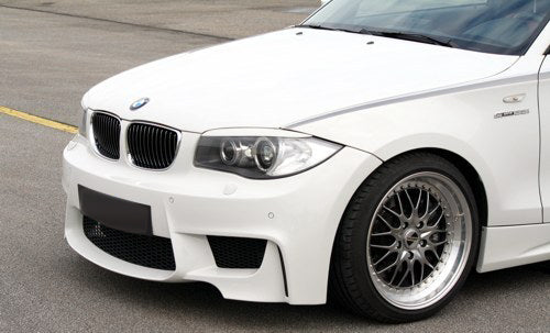 Front Side View of Front Bumper for BMW 1 Serie E81/E82/E87/E88 1M Look on vehicle. Made from 1st grade FRP (reinforced fiberglass)