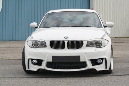 Front View of Front Bumper for BMW 1 Serie E81/E82/E87/E88 1M Look Fog Lights (Fog Lights not included) on vehicle. Made from 1st grade FRP (reinforced fiberglass)