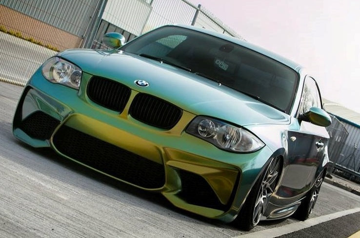 Front View of Front Bumper for BMW 1 Series E81/E82/E87/E88 M2 Look on vehicle. Made from 1st grade FRP (reinforced fiberglass)