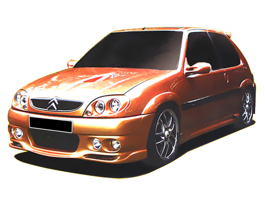 Orange Citroën Saxo with Demon front bumper, featuring a sleek aerodynamic design with integrated fog lights and an aggressive tuning style.