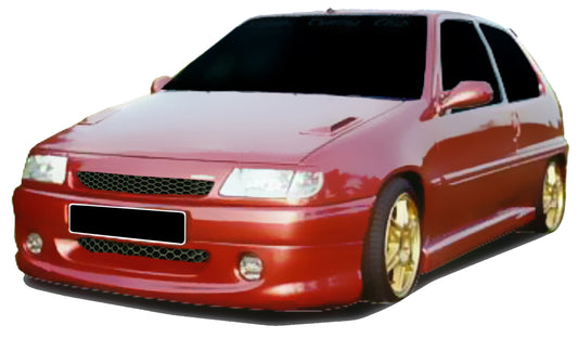 Red Citroën Saxo equipped with a custom front bumper, featuring dual air intakes and integrated fog lights for a sporty and aerodynamic appearance.