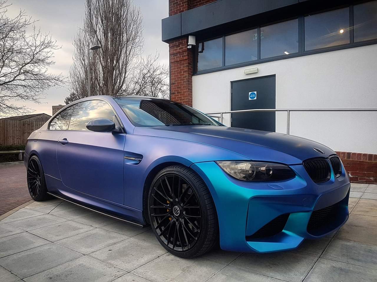 Side View of Front Bumper for BMW 3 Series E92/E93 COUPE M2 Look, on vehicle. Made from 1st grade FRP (reinforced fiberglass)