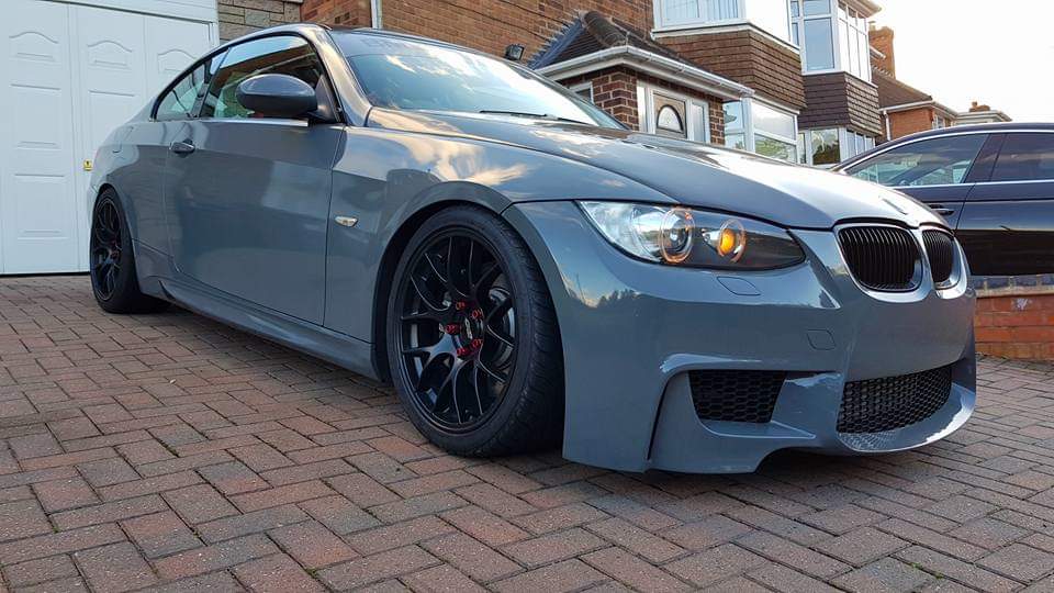 Side View of Front Bumper for BMW 3 Series M3 Coupe E92/E93 PRE-LCI 1M Look on vehicle. Made from 1st grade FRP (reinforced fiberglass)