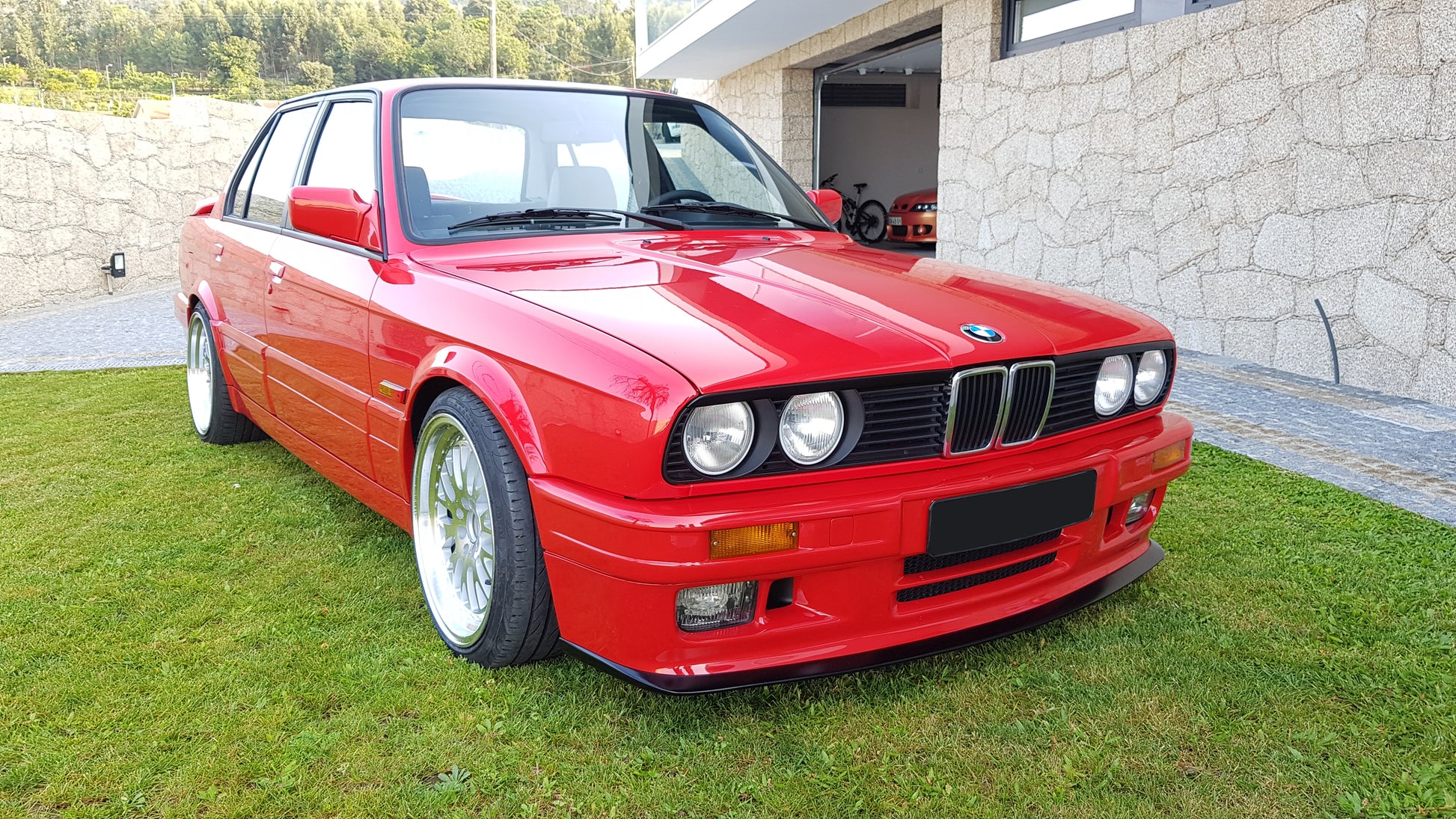 Front View of Front Bumper for BMW 3 SERIES E30 M-TECK PH1 and PH2 on vehicle (Front Lip & Fog Lights not included). Made from 1st grade FRP (reinforced fiberglass)