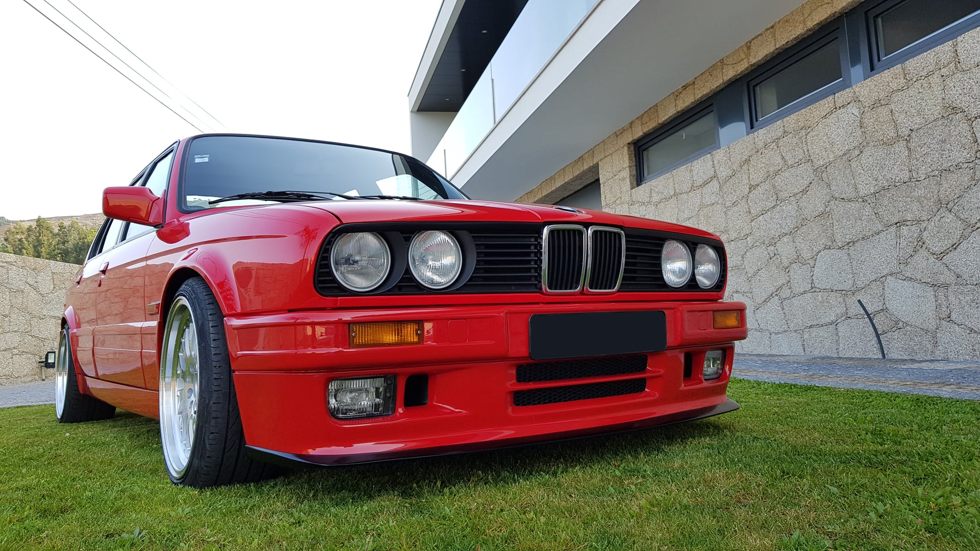 Front View of Front Bumper for BMW 3 SERIES E30 M-TECK PH1 and PH2 on vehicle (Front Lip & Fog Lights not included). Made from 1st grade FRP (reinforced fiberglass)