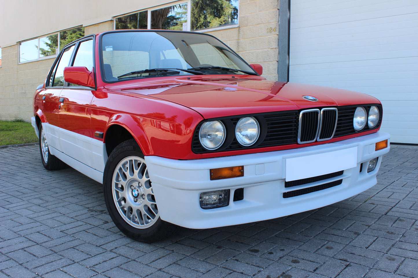 Front View of Front Bumper for BMW 3 SERIES E30 M-TECK PH1 and PH2 on vehicle (Front Lip & Fog Lights not included). Made from 1st grade FRP (reinforced fiberglass)