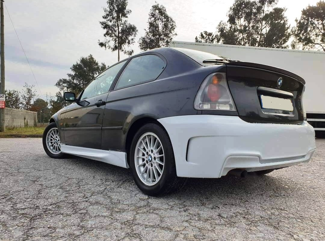 Back View of Rear Bumper for BMW 3 Series E46 COMPACT 1M Look & Rear Diffuser 1M Look Double Exhaust Left Side on vehicle. Made from 1st grade FRP (reinforced fiberglass)